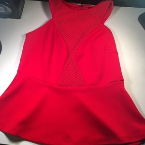 Red, tank top shirt. Has pretty designs on front.